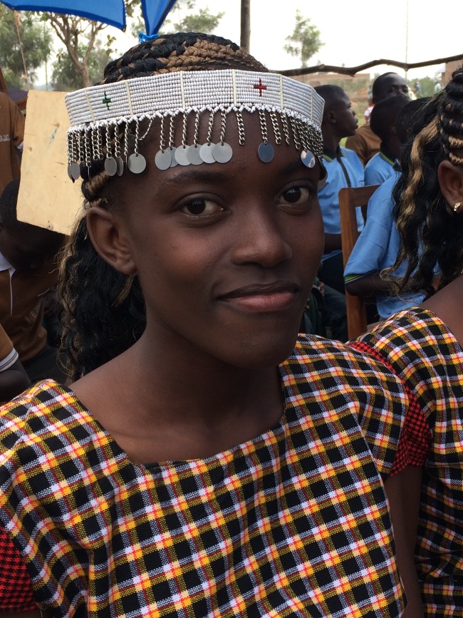 Girl smiling at ARP graduation in Tanzania, photo by UNFPA